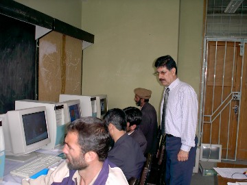 A professor of construction teaching a class in CAD.